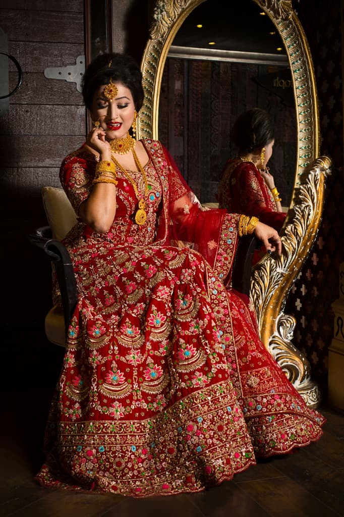 Woman in Red and Gold Bridal Lehenga